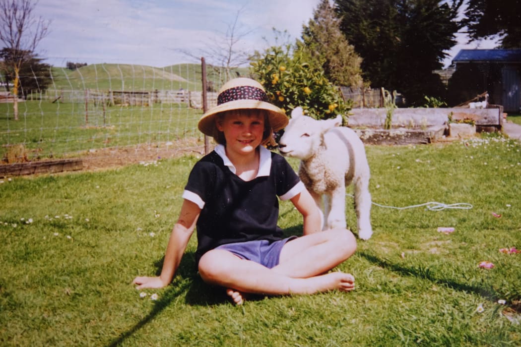 Busby as a lamb with four-year-old Olivia.