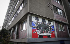 A mural depicting Russia's para military mercenaries 'Wagner Group' reading : "Wagner Group - Russian knights" on a building's wall in Belgrade, on November 17, 2022.