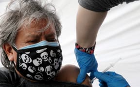 LOS ANGELES, CALIFORNIA - MARCH 25: Gregorio Noriega, originally from Mexico, receives a one-shot dose of the Johnson & Johnson COVID-19 vaccine at a clinic targeting immigrant community members on March 25, 2021 in Los Angeles, California.