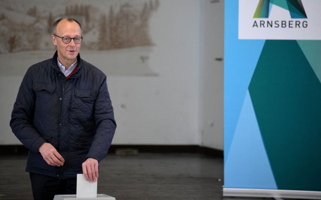Friedrich Merz, leader of Germany's conservative Christian Democratic Union (CDU) and his party's main candidate for Chancellor, casts his ballot for general elections on February 23, 2025 in Arnsberg, western Germany. (Photo by Sascha Schuermann / AFP)