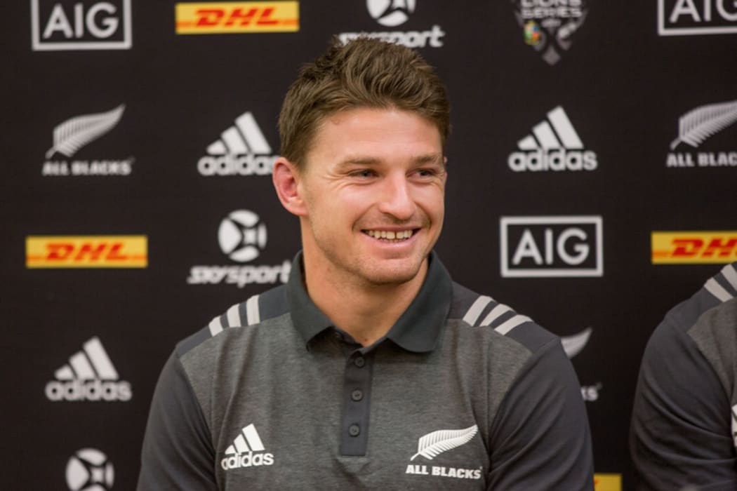 Beauden Barrett at a press conference with his two brothers, Scott and Jordie.