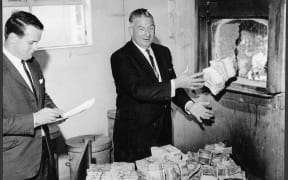 Sterling bank notes being destroyed, Wellington, New Zealand. Dominion Post (Newspaper): Photographic negatives and prints of the Evening Post and Dominion newspapers.