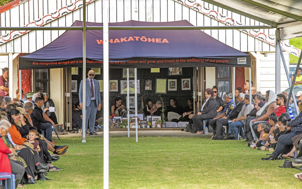 Maraenui Marae resounds to the sound of haka as pall bearers take the coffin from the marae.
