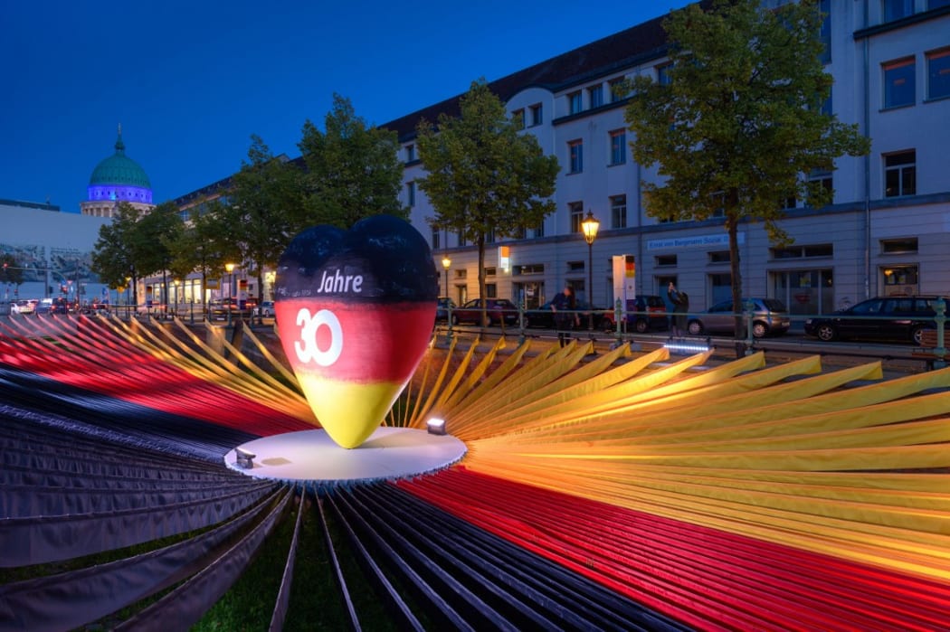 A black-red-golden heart is in the centre of black, red and yellow fabric panels in the exhibition "Path to Unity" at the Unity EXPO. Potsdam, as the capital of Brandenburg, is this year's host of the central celebrations of German Unity Day.