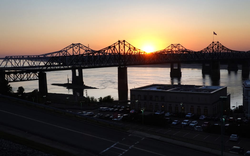 The sun sets on the Mississippi River on October 20, 2022 at Vicksburg, Mississippi. Lack of rain in the Ohio River Valley and along the Upper Mississippi has the Mississippi River south of the confluence of the Ohio River nearing record low levels which is wreaking havoc with barge traffic, driving up shipping prices and threatening crop exports and fertilizer shipments as the soybean and corn harvest gets into full swing.