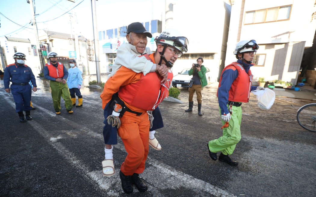 Firefighters conduct rescue operation in Motomiya City, Fukushima prefecture on Oct. 13, 2019, one day after Typhoon No. 19, known as Typhoon Hagibis, a powerful super typhoon, made a landfall.