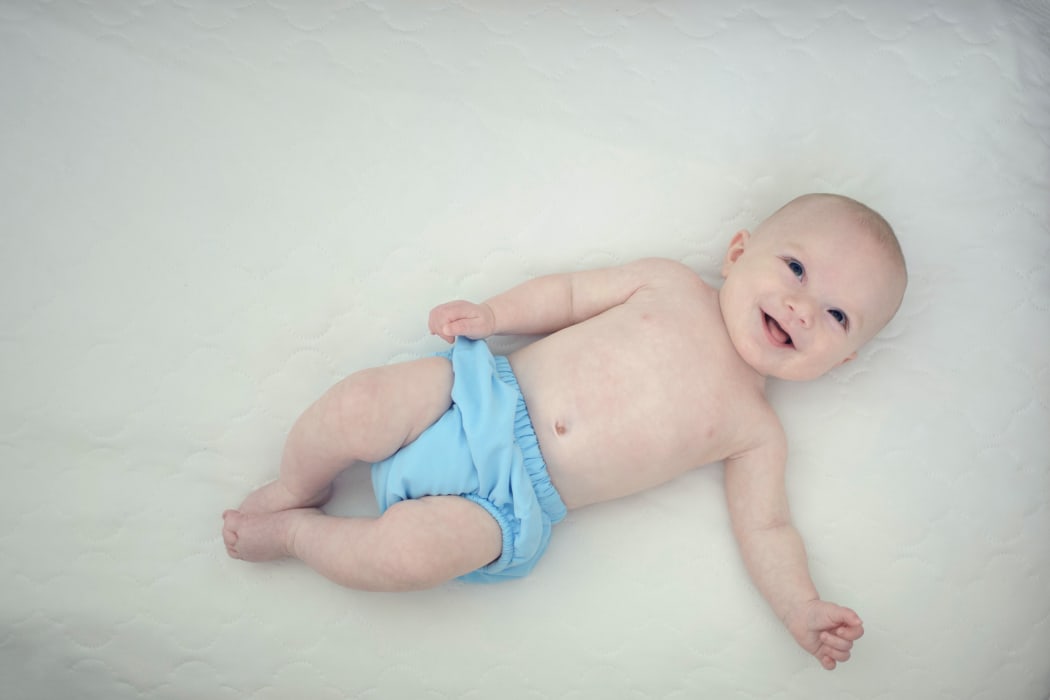 baby in cloth nappy