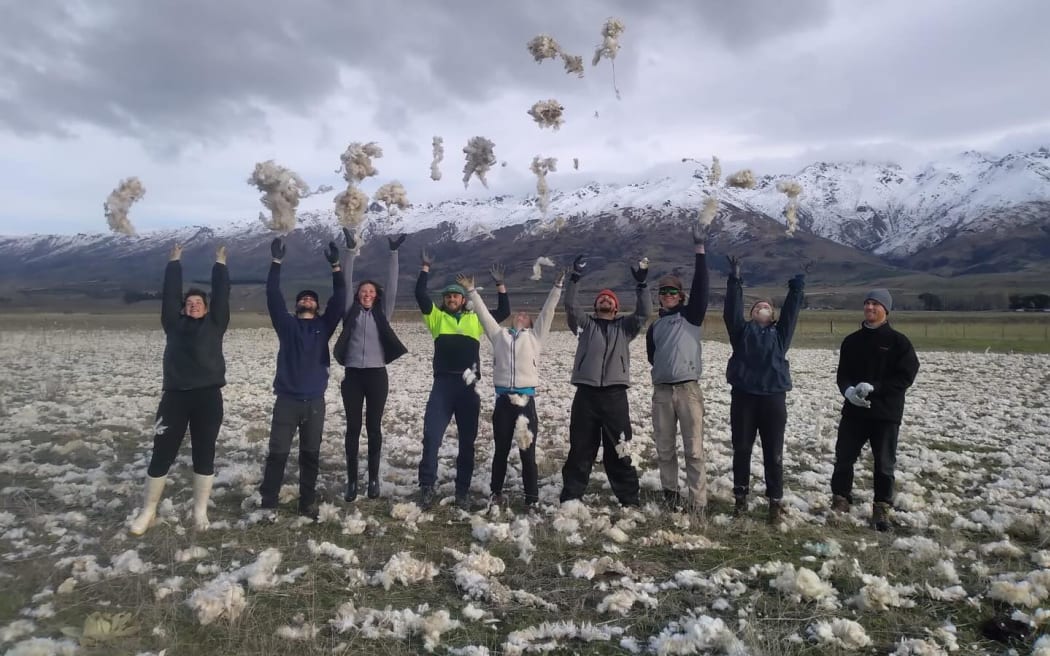 Workers from Tinwald Farm after spreading wool over a degraded paddock.