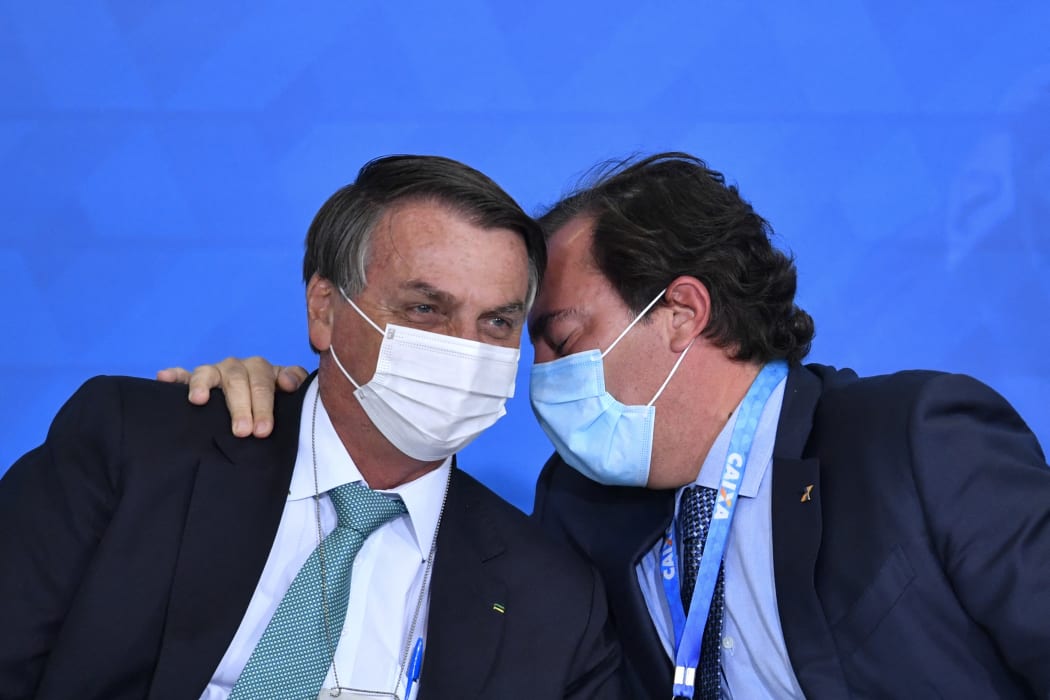 Brazilian President Jair Bolsonaro and  president of Caixa, Pedro Guimaraes.