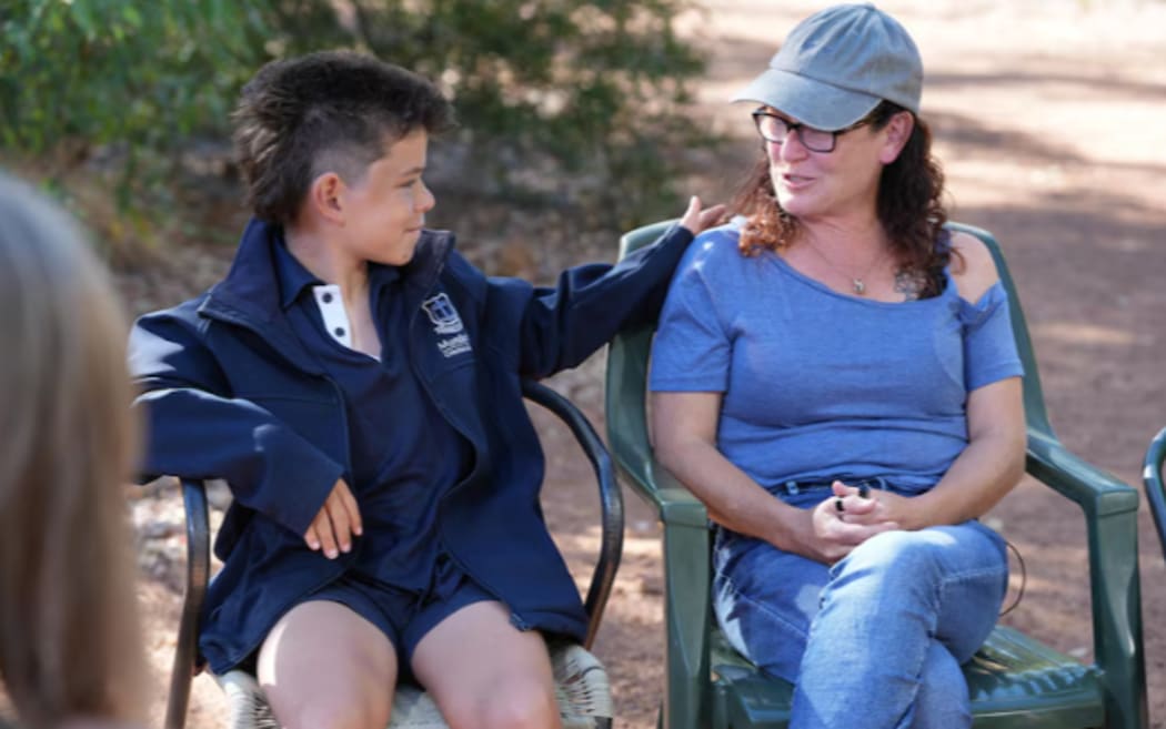 Joanne and her family spoke to reporters before school on Tuesday morning. (ABC News: Briana Shepherd)