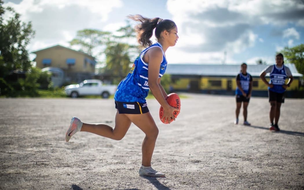 Local AFL games in Nauru - played on the gravel ground.