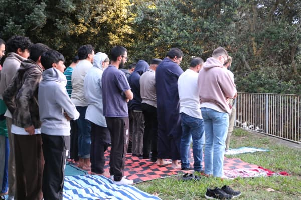 Muslims standing praying outdoors after the sun has set at Point Chevalier's Coyle Park on 18 February, 2026.