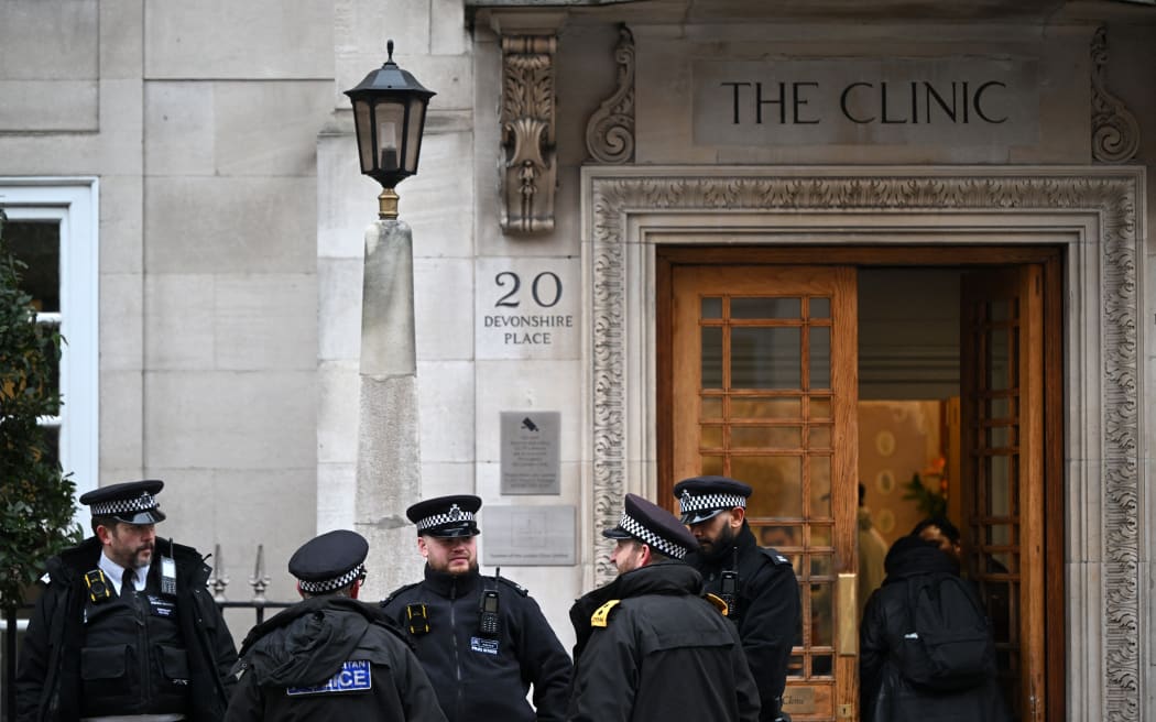 Police officers stand guard outside the London Clinic in London on January 17, 2024. Britain's Catherine, Princess of Wales, is facing up to two weeks in hospital after undergoing successful abdominal surgery, Kensington Palace announced on Wednesday. (Photo by JUSTIN TALLIS / AFP)