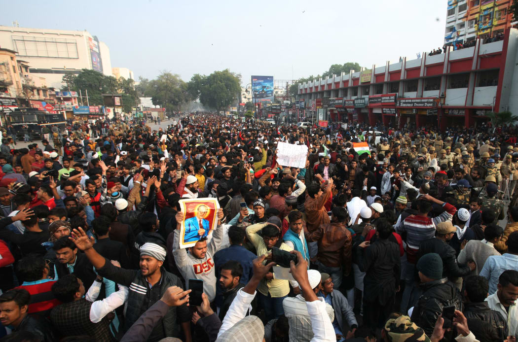 protesters gather on road at a demonstration against India's new citizenship Law in Allahabad on December 20, 2019