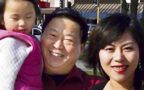 Nai Yin Xue (centre) with his wife An An Liu with daughter Qian Xun Xie.
