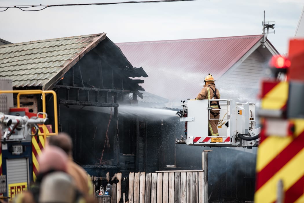 Firefighters tackling a blaze in a house on Yule Street, Kilbirnie, Wellington