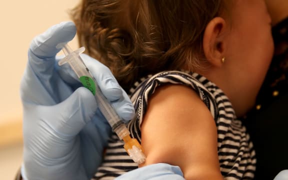 girl being vaccinated against measles