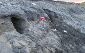 A sand dune collapsed on a man as he was digging into it at Muriwai Beach.
