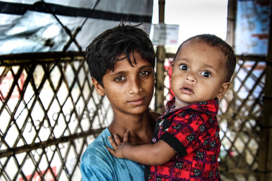 Two children visiting Medair's health post in Kutupalong camp in Bangladesh. Photo taken during visit to Kutupalong with Florian Ecuyer to film episodes for "Medair Lives".