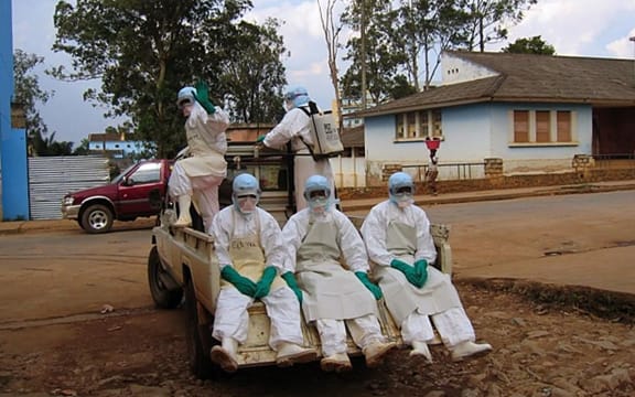 Health workers during a 2005 Ebola outbreak in Angola.