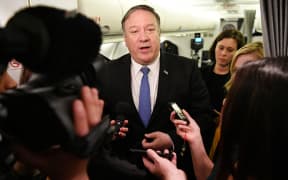 US Secretary of State Mike Pompeo speaks to reporters in flight after a previously unannounced trip to Baghdad on May 8, 2019