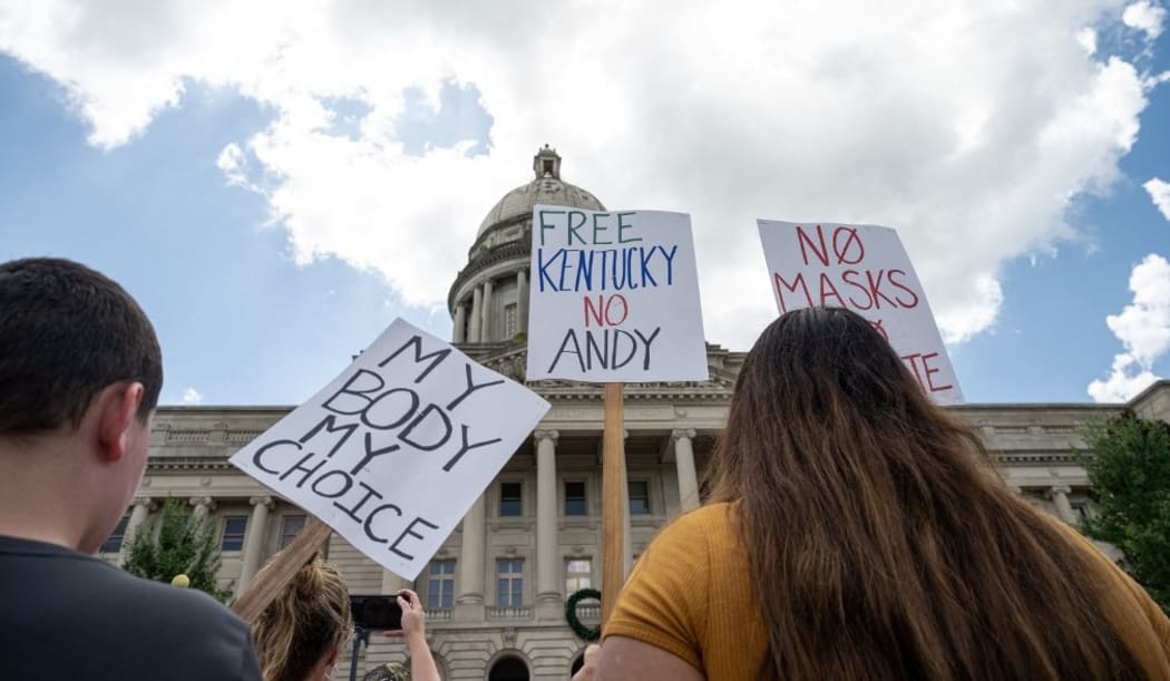 FRANKFORT, KY - AUGUST 28: People display anti-COVID-19 mandate signs during the Kentucky Freedom Rally at the capitol building on August 28, 2021 in Frankfort, Kentucky.