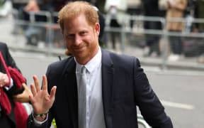 Prince Harry, Duke of Sussex, waves as he arrives to the Royal Courts of Justice, Britain's High Court, in central London on June 7, 2023.