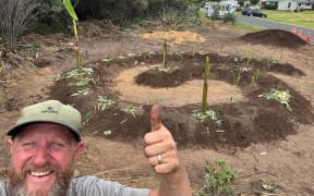 Food forest enthusiast Kris Edgington in front of a garden he's just started establishing.