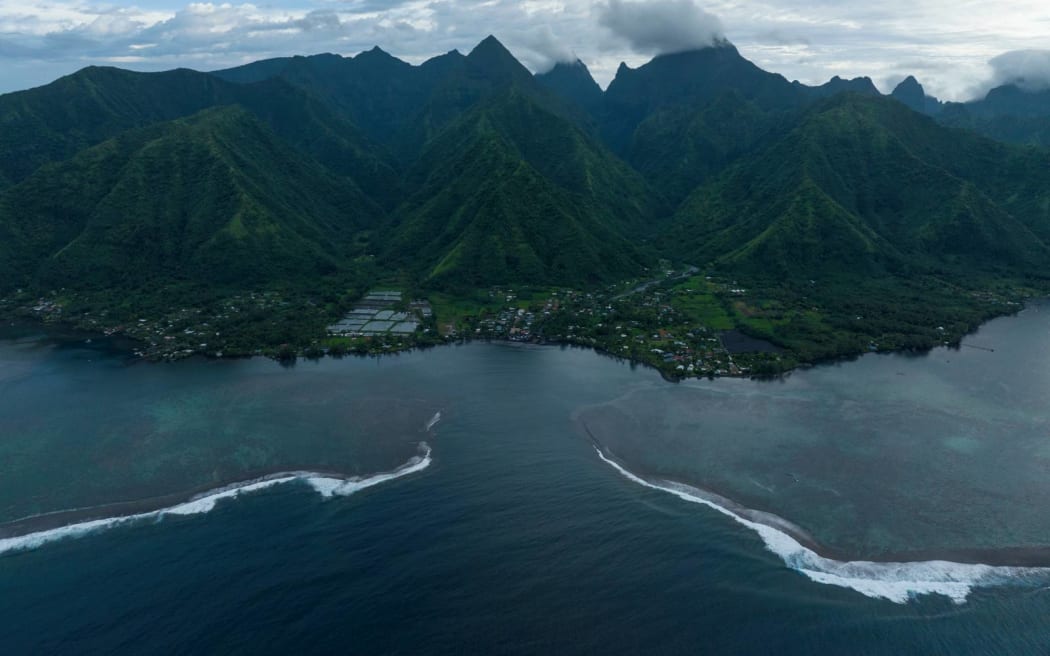 The surf breaks onto the lagoon in Teahupo'o, Tahiti, French Polynesia, Wednesday, Jan. 17, 2024. Teahupo'o will host the surfing competitions during the Olympic Games. (AP Photo/Daniel Cole)