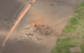 The explosion caused a crater seven metres wide and a metre deep in the middle of the taxiway next to the runway.
