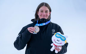 Silver medallist Lucia Georgalli celebrates on the podium following the Snowboard Women's Slopestyle at the Welli Hilli Park Ski Resort on 24 January, 2024. The Winter Youth Olympic Games, Gangwon, South Korea.