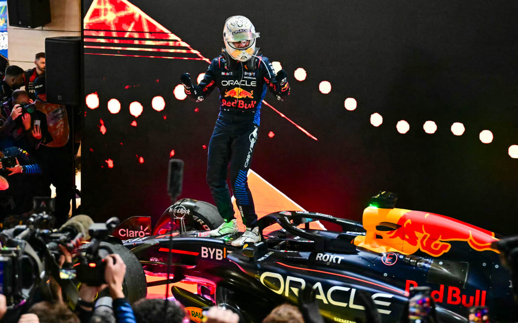 Red Bull Racing's  Max Verstappen celebrates after winning the Qatari Formula One Grand Prix at the Lusail International Circuit. December 2024.