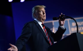 US President Donald Trump gestures as he addresses a press conference on the second day of the North Atlantic Treaty Organization (NATO) summit in Brussels.