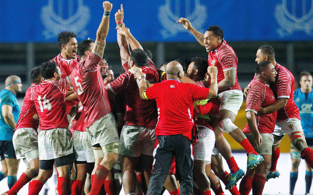 Tonga rugby players celebrate.