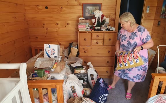 Diana Greer, founder of Collective Hug, with donated ingredients to be cooked up and turned into frozen meals and fresh baking for rural communities affected by Cyclone Gabrielle