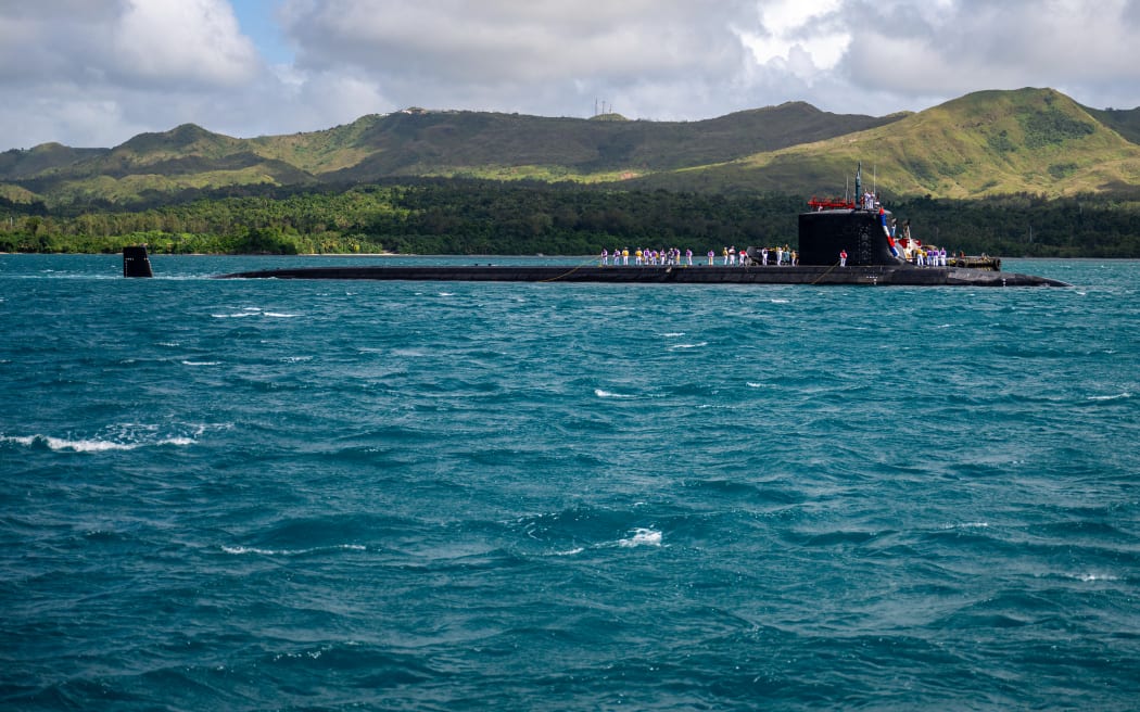The Virginia-class nuclear powered submarine USS Minnesota arrives at the US Naval Base Guam, on 26 November 2024.