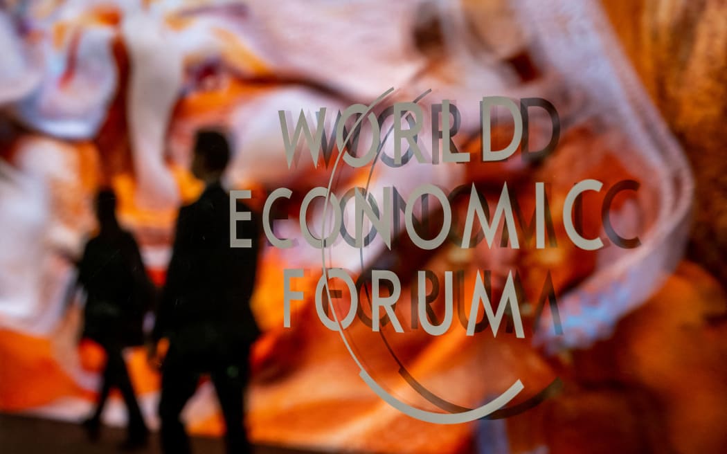 A photograph shows a sign of the World Economic Forum (WEF) at the Congress centre on the opening day of the World Economic Forum (WEF) annual meeting in Davos on January 16, 2023. - The world's political and business elites gather for the annual Davos summit to promote "cooperation in a fragmented world", with war in Ukraine, the climate crisis and global trade tensions high on the agenda. (Photo by Fabrice COFFRINI / AFP)