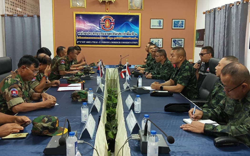 Commanders of the Royal Thai Army (R) and Royal Cambodian Army (L) meet at the Thai-Cambodia border.