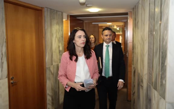 Jacinda Ardern and James Shaw on their way to unveil the zero carbon bill.