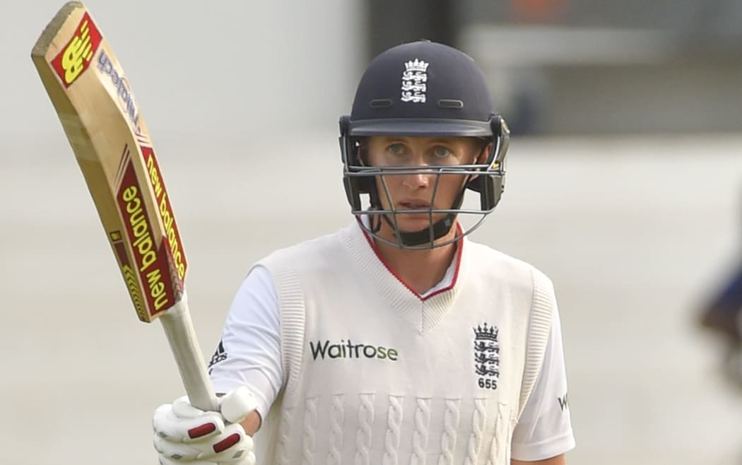The England batsman Joe Root celebrates scoring a century.