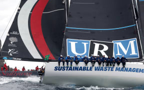 Yacht URM leads Scallywagg (L) at the start of the annual Sydney to Hobart yacht race on Boxing Day at Sydney Harbour on December 26, 2025.