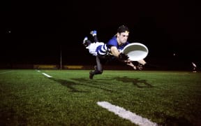 Matt Dol in full flight playing ultimate frisbee.