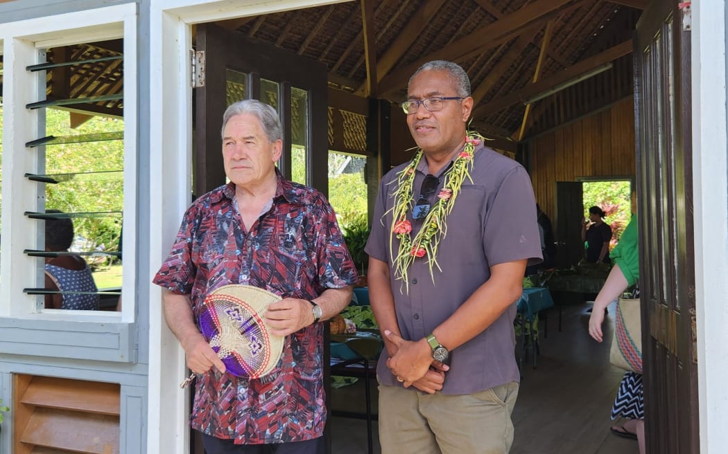 New Zealand Foreign Affairs Minister Winston Peters stands with leader of the Independent Group Peter Kenilorea Jr