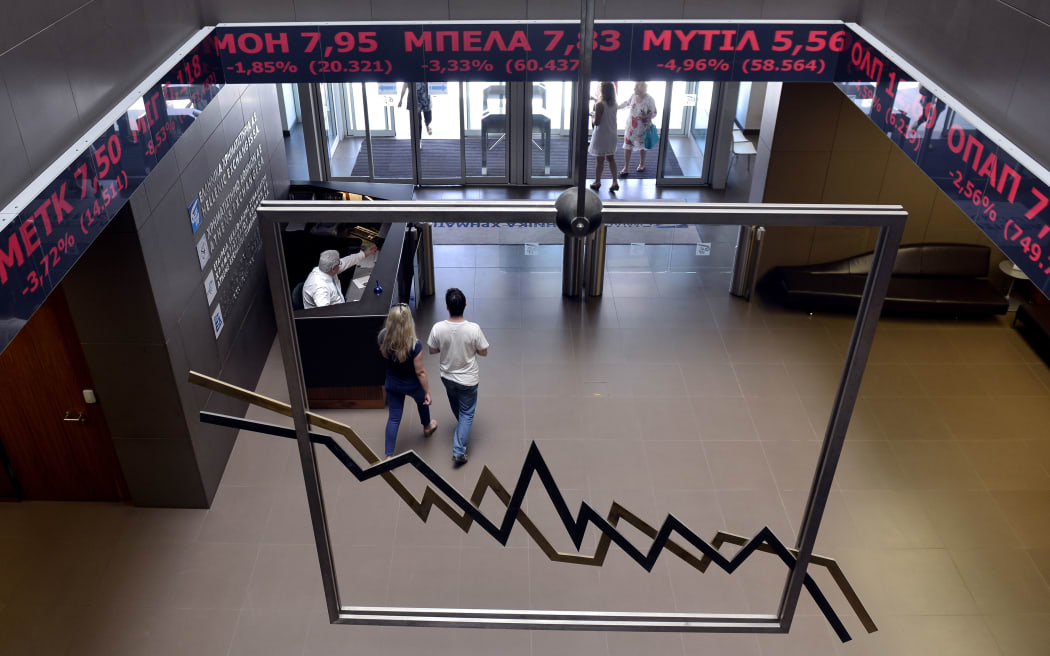 June 15, 2015: people walk through the Athens Stock Exchange lobby. Greece's main stock exchange in Athens will reopen on August 3, 2015 after being closed for five weeks by the debt crisis