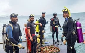 Photo of some of the professional divers who were sucked into a 75cm-bore oil pipeline off the Caribbean island of Trinidad in early 2022
