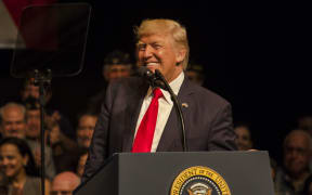 US President Donald Trump speaks about policy changes he is making toward Cuba in Little Havana in Florida.