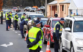 Police in the southern New South Wales (NSW) border city of Albury check cars crossing the state border from Victoria.
