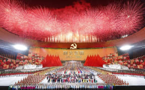 (220106) -- BEIJING, Jan. 6, 2022 (Xinhua) -- An art performance titled "The Great Journey" is held in celebration of the 100th anniversary of the founding of the Communist Party of China (CPC) at the National Stadium in Beijing, capital of China, on the evening of June 28, 2021.