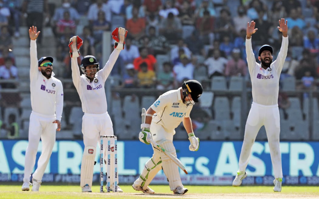 Indian players appeal for Tom Latham of New Zealand's wicket during a test in Mumbai.