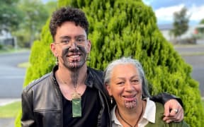 Tūranga Edmonds (left) and his mum Tania Morgan (right) after they both received their moko kanohi on the same day.